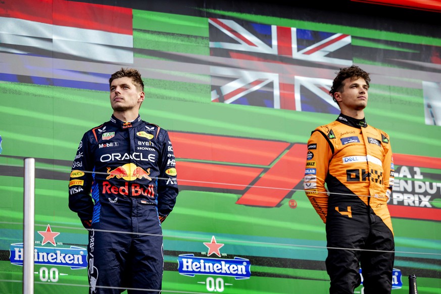 epa11564294 Winner Lando Norris (McLaren) and second placed Max Verstappen (Red Bull Racing) on the podium after the F1 Grand Prix of the Netherlands in Zandvoort, the Netherlands, 25 August 2024. EPA ...