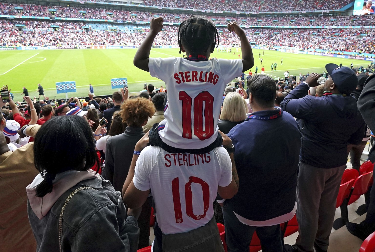 England&#039;s Raheem Sterling son Thiago celebrates with family after the final whistle of the Euro 2020 round of 16 match between England and Germany, at Wembley Stadium, London, Tuesday June 29, 20 ...