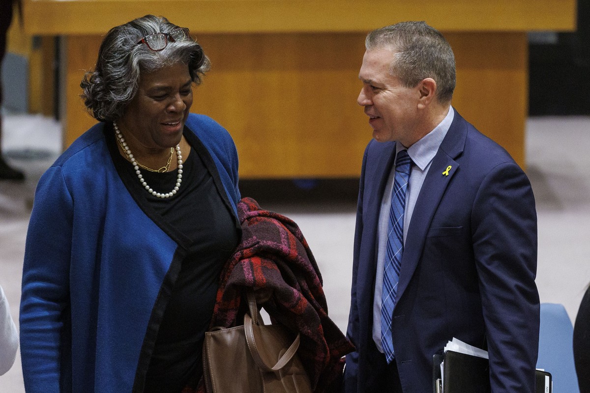 epa11236472 United States Ambassador Linda Thomas-Greenfield (L) and Israel Ambassador Gilad Erdan (R) chat following a vote on a resolution for a ceasefire in Gaza during a United Nations Security Co ...
