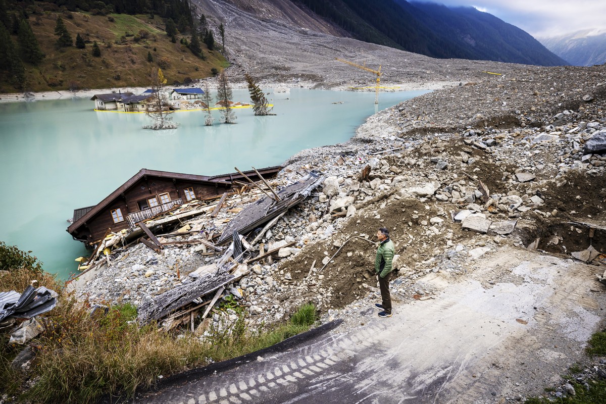 KEYPIX - Matthias Bellwald, mayor of the municipality of Blatten makes his way as he visits the destroyed village, 4 months after a landslide destroyed the village, in Blatten, Switzerland, on Wednesd ...