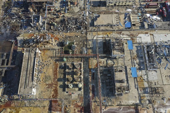 In this aerial photo released by China&#039;s Xinhua News Agency, damaged buildings are seen at the site of a factory explosion in a chemical industrial park in Xiangshui County of Yancheng in eastern ...