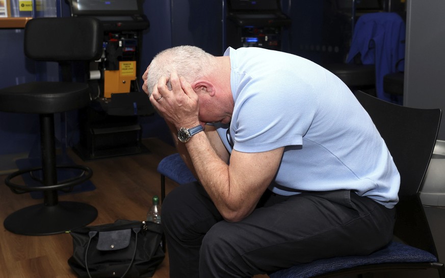 Former Rangers player Ian Durrant reacts after seeing the Rangers lose to Eintracht Frankfurt in the Europa League final on the screens at The Louden Tavern, in Glasgow, Scotland, Wednesday, May 18, 2 ...