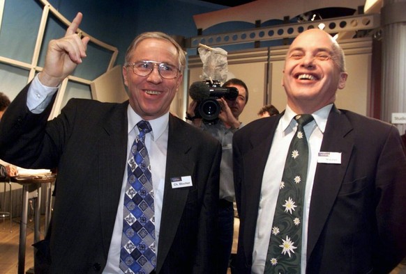 Christoph Blocher, National Councellor and intellectual leader of the populist right-wing People&#039;s Party &#039;SVP&#039; (left), and Ueli Maurer, party leader of the SVP, celebrate their victory  ...