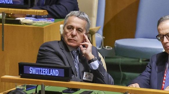 epa13256729 Vice President of Switzerland Ignazio Cassis (L) listens to President of the Swiss Confederation Guy Parmelin speak during the General Debate of the 81st session of the United Nations Gene ...
