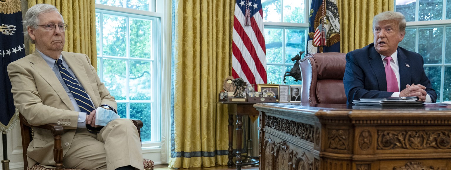 Senate Majority Leader Mitch McConnell of Ky., listens as President Donald Trump speaks during a meeting in the Oval Office of the White House, Monday, July 20, 2020, in Washington. (AP Photo/Evan Vuc ...