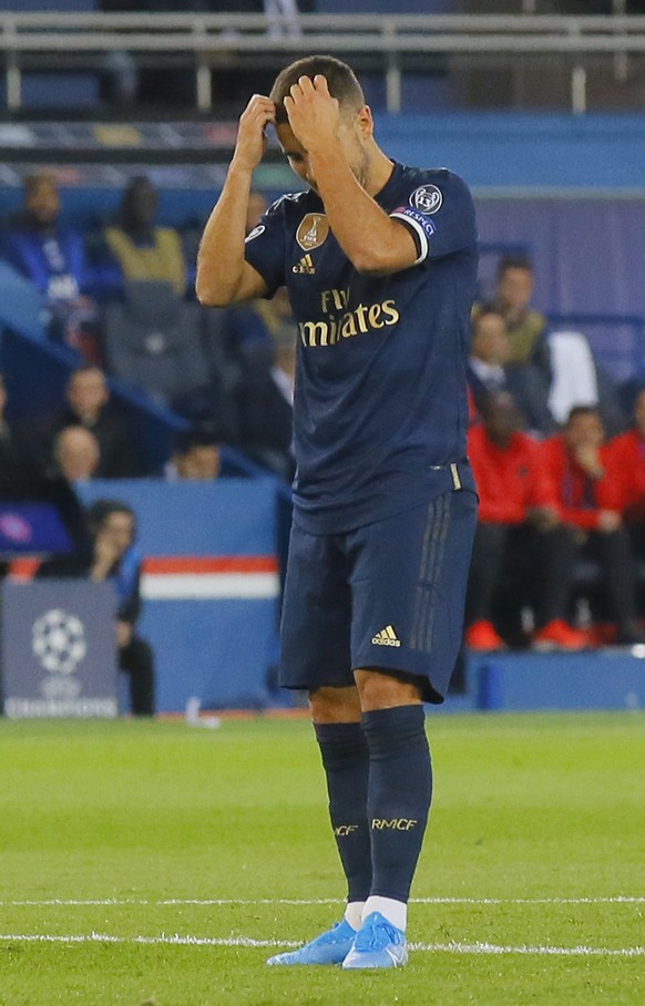 Real Madrid's Eden Hazard reacts after failing to score during the Champions League group A soccer match between PSG and Real Madrid at the Parc des Princes stadium in Paris, Wednesday, Sept. 18, 2019. (AP Photo/Michel Euler)