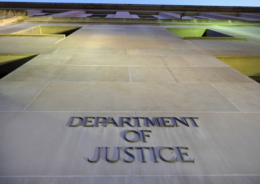 FILE - In this May 14, 2013, file photo, the Department of Justice headquarters building in Washington is photographed early in the morning. The Justice Department is opening up about the advice it ha ...