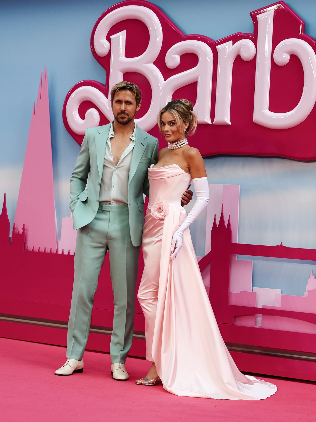 epa10742558 Canadian actor Ryan Gosling (L) and Australian actor Margot Robbie (R) pose on the pink carpet at the European premiere of 'Barbie' in central London, Britain, 12 July 2023. The  ...