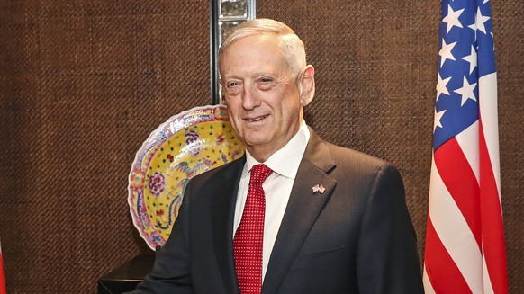 U.S. Defense Secretary Jim Mattis, right, and Malaysia&#039;s Defense Minister Mohamad Sabu shake hands before their bilateral meeting at the 17th International Institute for Strategic Studies (IISS)  ...