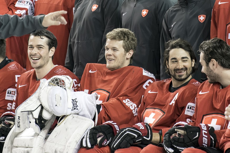 Switzerland&#039;s Raphael Diaz, goaltender Leonardo Genoni, Andres Ambuehl and Denis Hollenstein, from left, pose during a photo session before a training session during the Ice Hockey World Champion ...