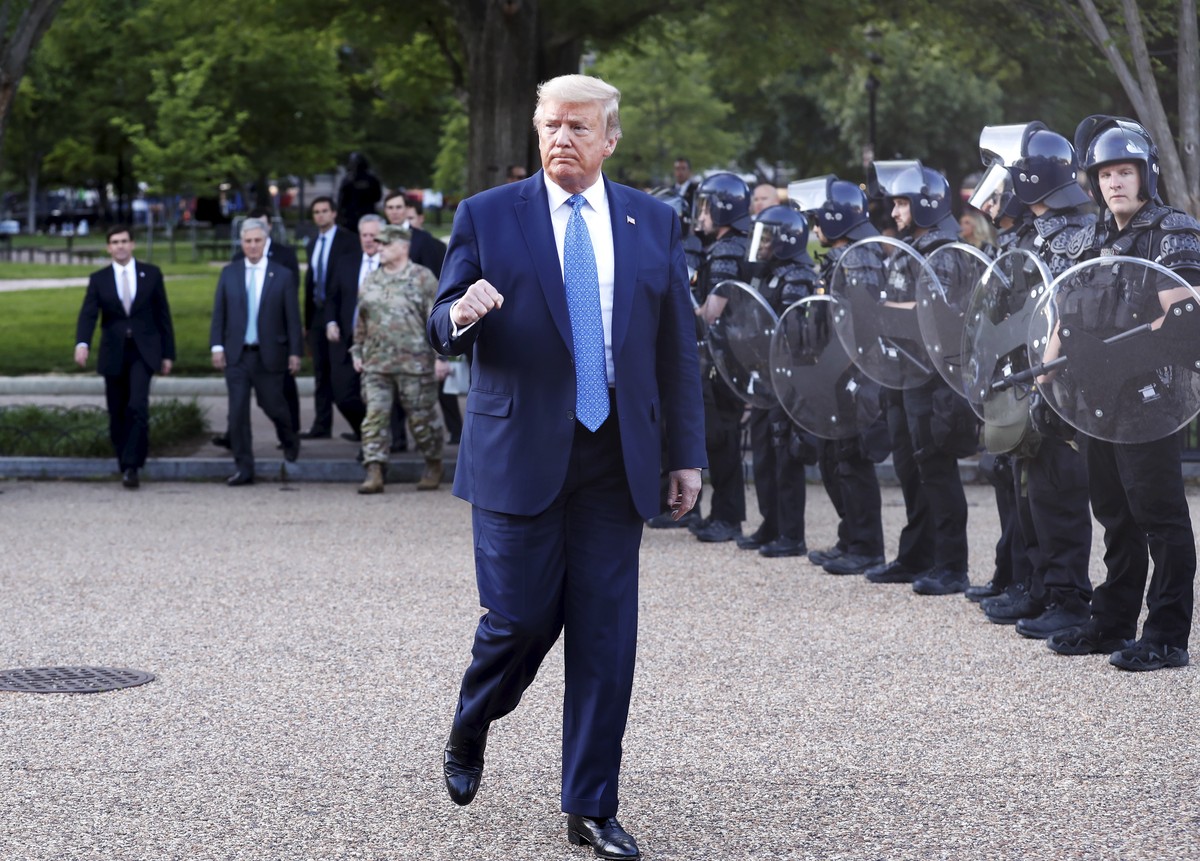 epaselect epa08459195 US President Donald J. Trump returns after posing with a bible outside St. John's Episcopal Church after delivering remarks in the Rose Garden at the White House in Washingt ...