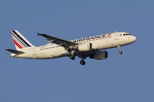 An Air France Airbus A320 approaches for landing in Lisbon at sunrise, Tuesday, Oct. 10, 2023. (AP Photo/Armando Franca)