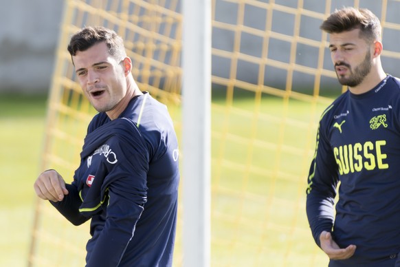 Switzerland?s national team soccer player Eray Coemert, right, and Granit Xhaka, left, during a training session on the eve of the UEFA Euro 2020 qualifying Group D soccer match between the Switzerlan ...