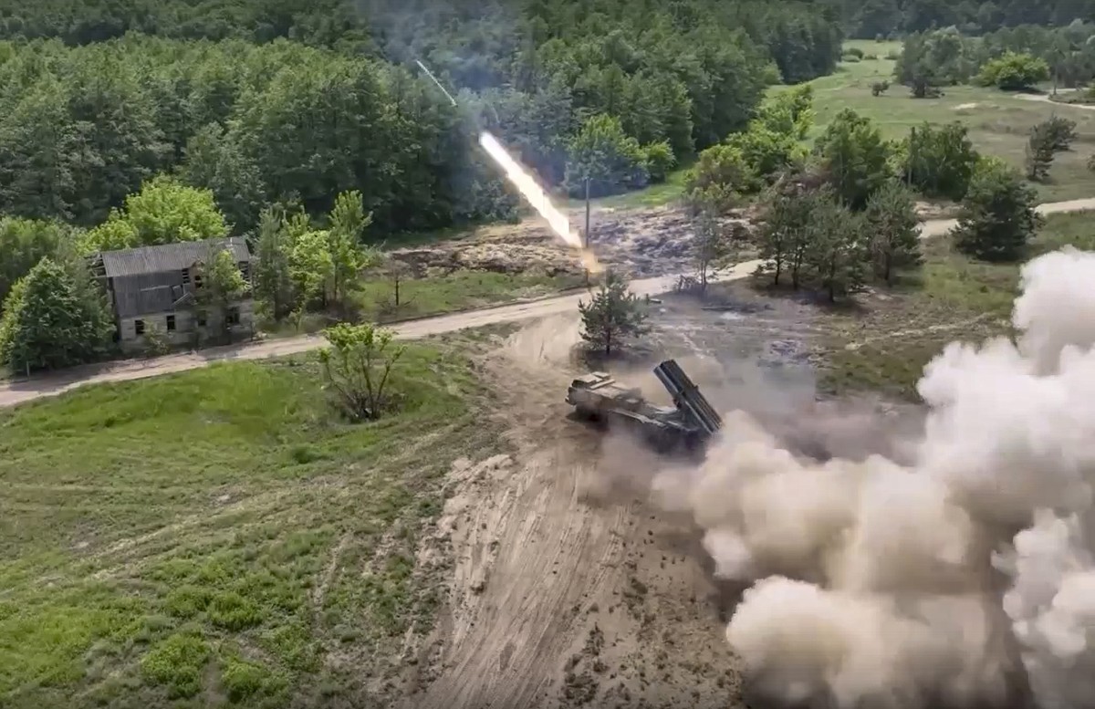 In this handout photo by Russian Defense Ministry Press Service released on Saturday, June 25, 2022, a Russian military's multiple rocket launcher fires rockets at Ukrainian troops at an undisclo ...
