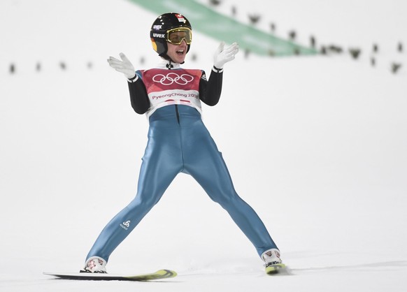 epa06511955 Simon Ammann from Switzerland reacts in the final round of the Men&#039;s Normal Hill Individual Ski Jumping competition at the Alpensia Ski Jumping Centre during the PyeongChang 2018 Olym ...