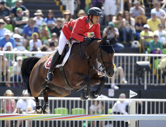 2016 Rio Olympics - Equestrian - Final - Jumping Team Finals - Olympic Equestrian Centre - Rio de Janeiro, Brazil - 17/08/2016. Steve Guerdat (SUI) of Switzerland riding Nino Des Buissonnets competes. ...