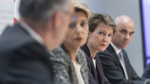 Swiss Federal president Simonetta Sommaruga, second right, and from left, Federal councillors Guy Parmelin, Karin Keller-Sutter and Alain Berset brief the media about the latest measures to fight the  ...