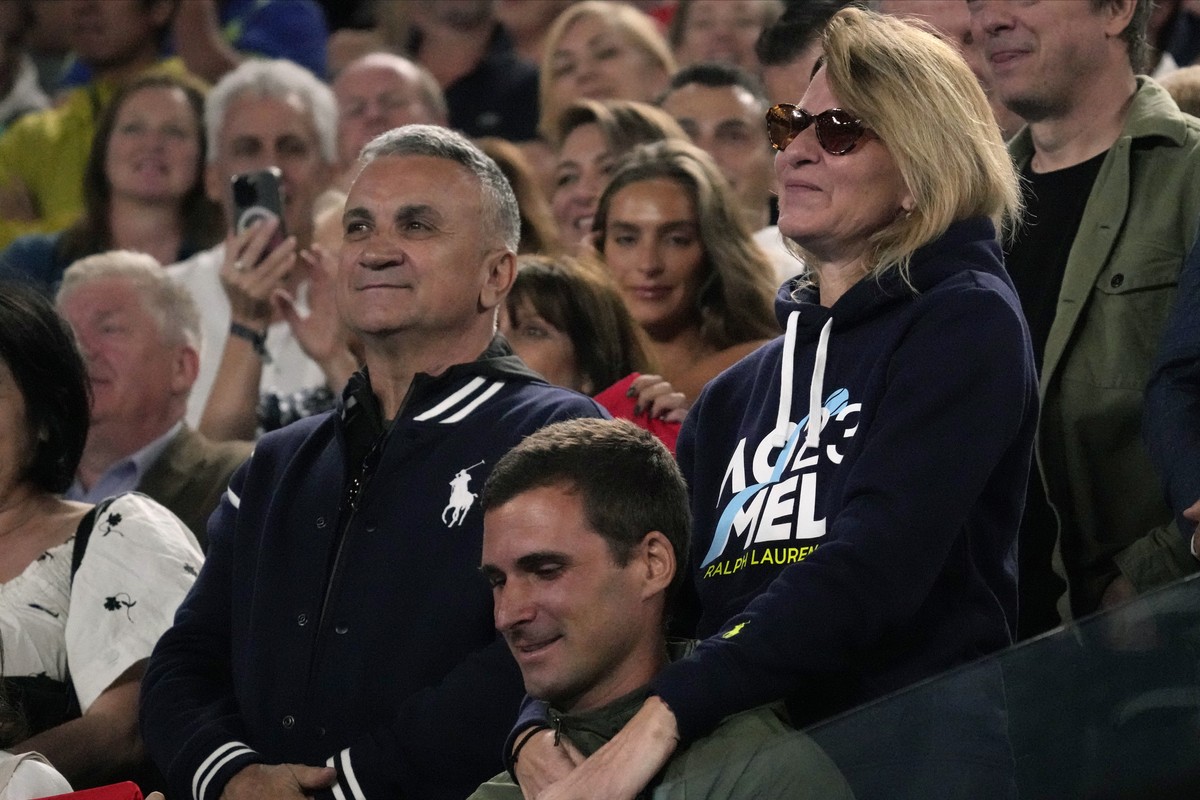 The parents of Novak Djokovic of Serbia, father Srdjan and mother Dijana react during his post match speech following his win over Andrey Rublev of Russia at the Australian Open tennis championship in ...