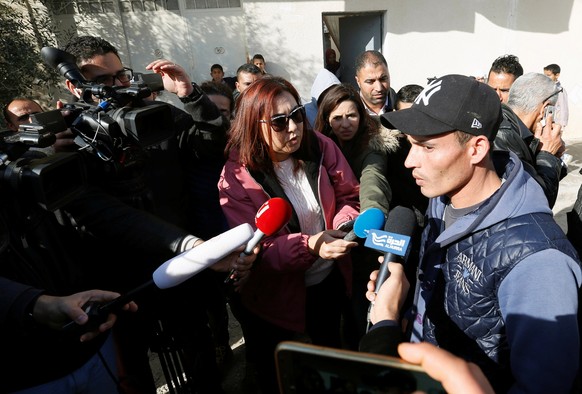 Walid, brother of suspect Anis Amri who is sought in relation with the truck attack on a Christmas market in Berlin, speaks to members of the media near their home in Oueslatia, Tunisia December 22, 2 ...