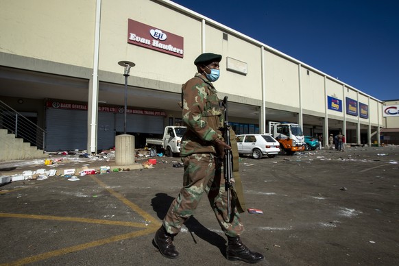 A soldiers patrol at a shopping centre in Soweto, Johannesburg Tuesday July 13, 2021. South Africa&#039;s rioting continued Tuesday with the death toll rising to 32 as police and the military struggle ...