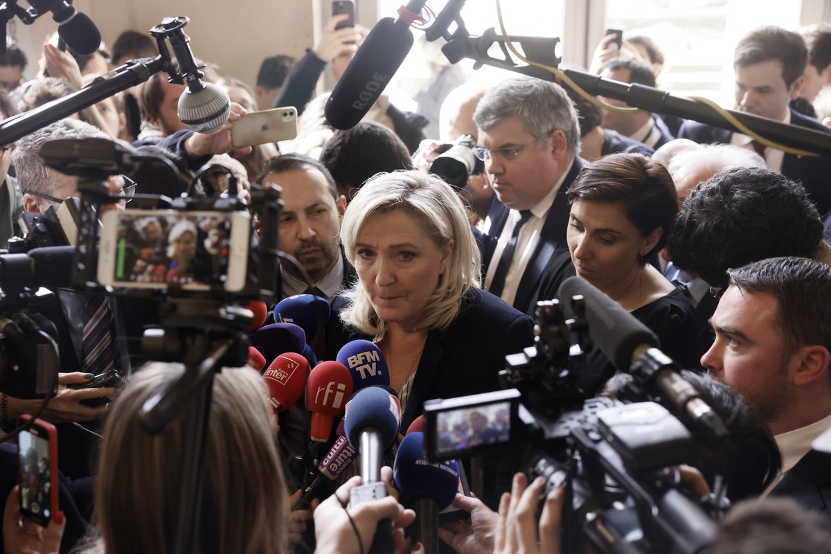 French far-right leader Marine Le Pen speaks to medias at the National Assembly in Paris, Thursday, March 16, 2023. France's government on Thursday invoked a special constitutional power to enact ...