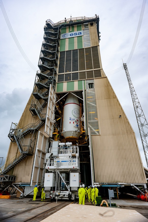 epa08076491 A handout photo made available by the European Space Agency (ESA) shows the upper composite of the Soyuz that will lift ESA&#039;s Cheops mission into space, being hoisted on top of the 3- ...