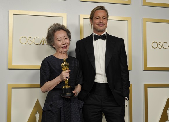 Brad Pitt, right, poses with Yuh-Jung Youn, winner of the award for best actress in a supporting role for &quot;Minari,&quot; in the press room at the Oscars on Sunday, April 25, 2021, at Union Statio ...