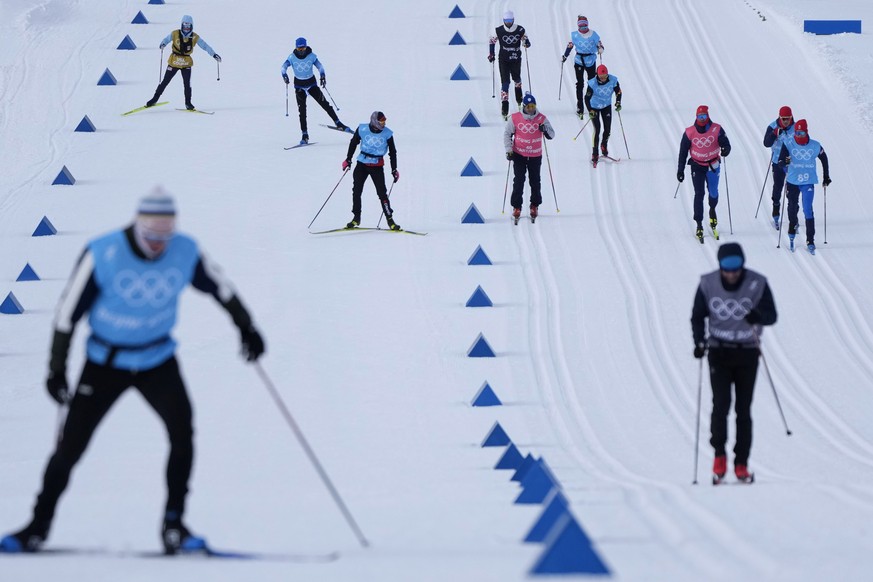 Skiers practice during a cross-country skiing training session before the 2022 Winter Olympics, Friday, Feb. 4, 2022, in Zhangjiakou, China. (AP Photo/Alessandra Tarantino)