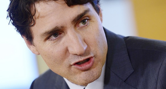 Canada Prime Minister Justin Trudeau takes part in a Women One roundtable discussion at the Case Foundation in Washington, D.C. on Wednesday, Oct. 11, 2017. (Sean Kilpatrick/The Canadian Press via AP)