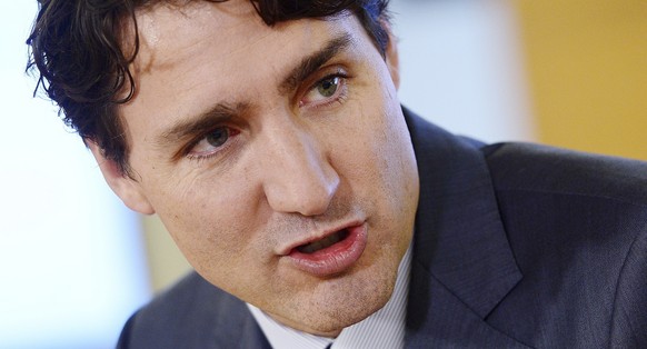 Canada Prime Minister Justin Trudeau takes part in a Women One roundtable discussion at the Case Foundation in Washington, D.C. on Wednesday, Oct. 11, 2017. (Sean Kilpatrick/The Canadian Press via AP)