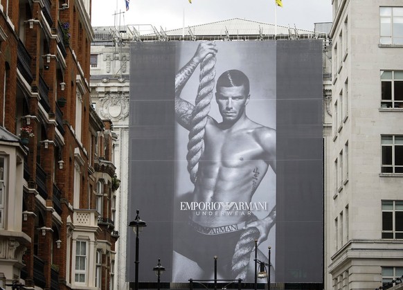 A poster of England soccer player David Beckham promoting the new Fall/Winter Emporio Armani underwear campaign in London, Thursday June 11, 2009. (AP Photo/Joel Ryan)