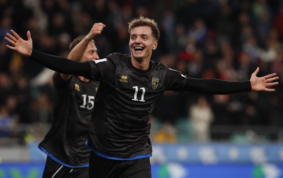 epa12528561 Kosovo&#039;s Fisnik Asllani celebrates after Slovenia&#039;s Zan Karnicnik scores own goal for 0-2 during the FIFA World Cup 26 UEFA qualifier between Slovenia and Kosovo in Ljubljana, Sl ...