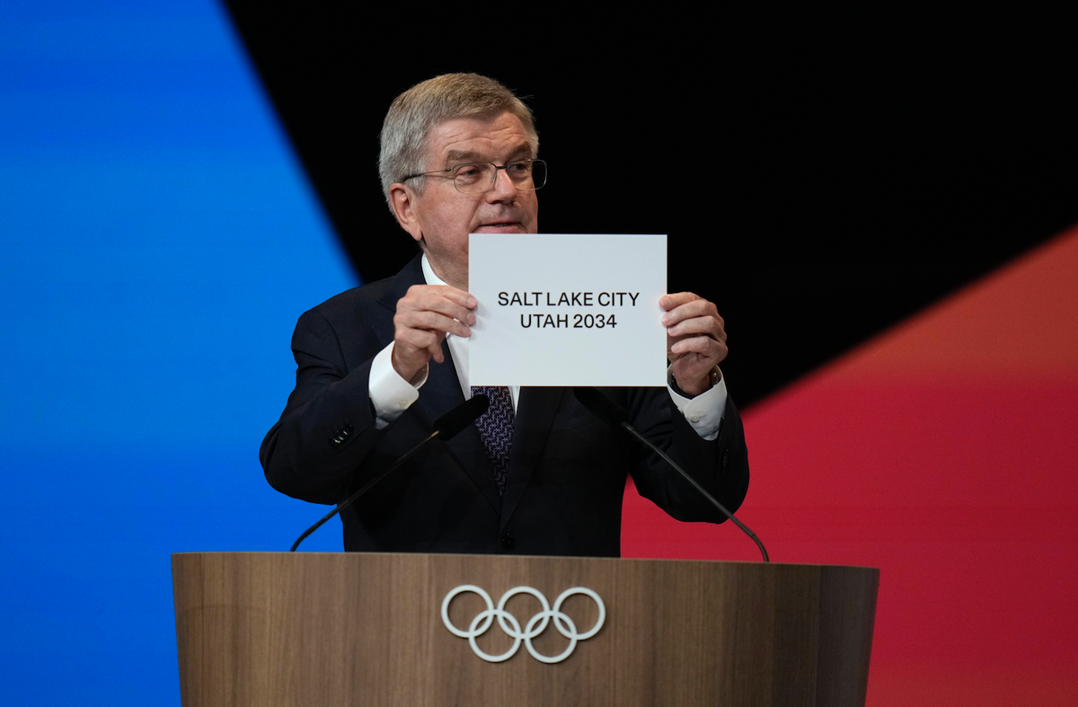 (240724) -- PARIS, July 24, 2024 -- International Olympic Committee (IOC) president Thomas Bach shows a sign that Salt Lake City of the United States has been awarded as the host of the 2034 Winter ga ...