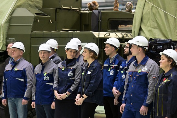 Employees of the Almaz-Antey Corporation&#039;s Obukhov Plant listen to Russian President Vladimir Putin in St. Petersburg, Russia, Wednesday, Jan. 18, 2023. (Ilya Pitalev, Sputnik, Kremlin Pool Photo ...