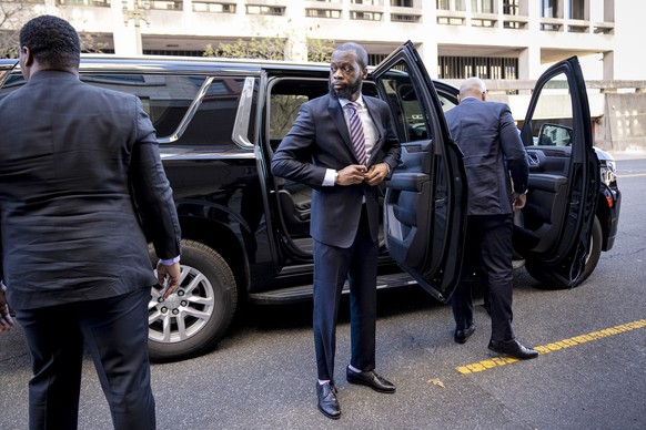 Prakazrel ?Pras? Michel, center, a member of the 1990s hip-hop group the Fugees, arrives at federal court for his trial in an alleged campaign finance conspiracy, Thursday, March 30, 2023, in Washingt ...