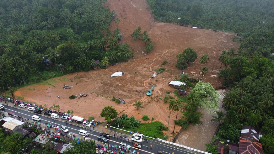 epa09887997 A photo taken with a drone shows a collapsed mountain side and buried houses in Bunga village, Baybay city, Leyte island, Philippines, 12 April 2022 (issued 13 April 2022). According to th ...