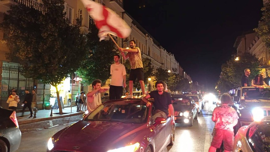 Georgia: Fans celebrate in Tbilisi as Georgia qualifies for Euro 2024 knockout stages GEORGIA, TBILISI - JUNE 27, 2024: Football fans celebrate Georgias victory over Portugal in their UEFA Euro 2024 G ...