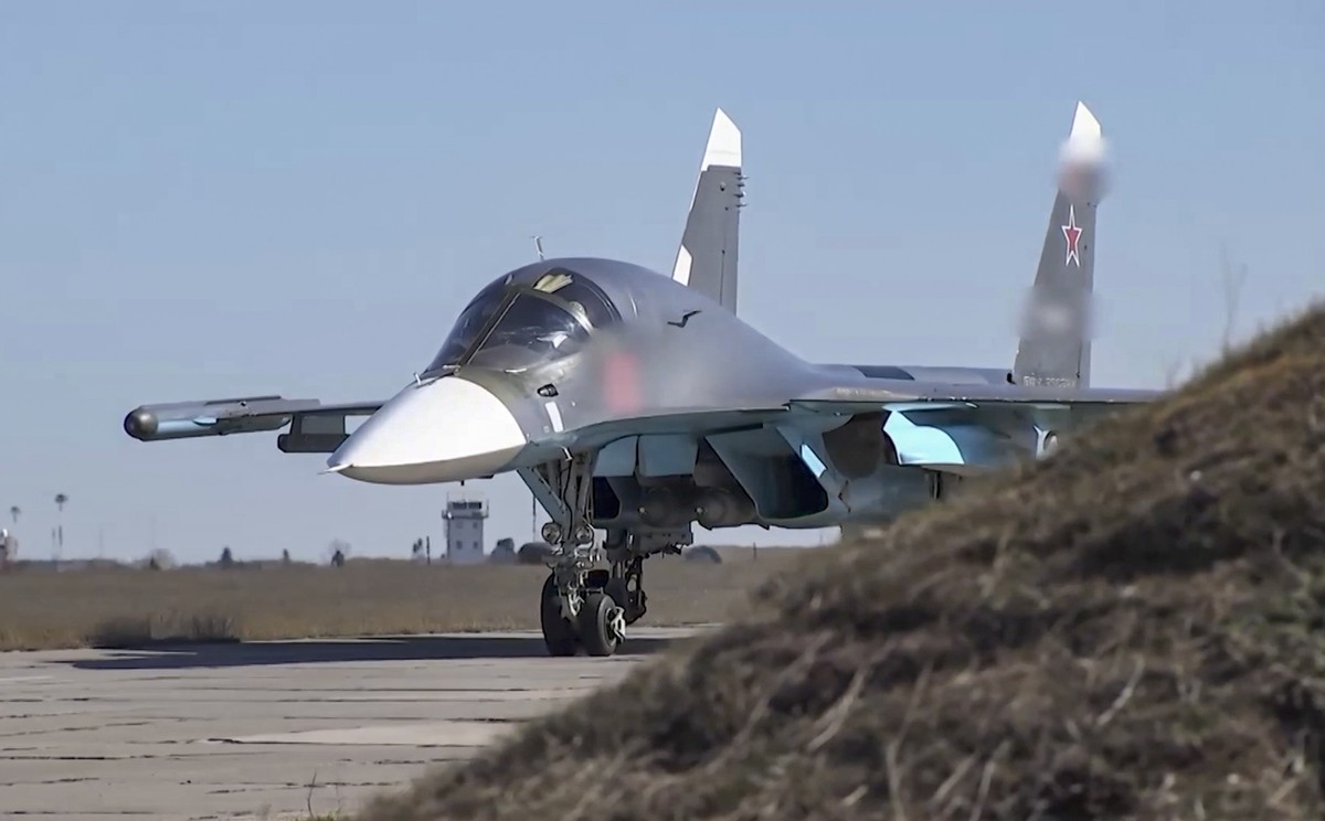 epa09898364 A handout still image taken from a handout video made available by the Russian Defence Ministry's press-service shows a Russian fighter-bombers Su-34 preparing to take off to carry ou ...