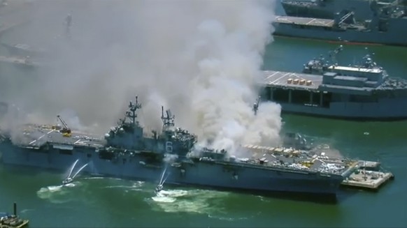 This screenshot provided by KGTV-TV in San Diego shows the USS Bonhomme Richard at Naval Base San Diego Sunday, July 12, 2020, in San Diego after an explosion and fire Sunday on board the ship at Nava ...