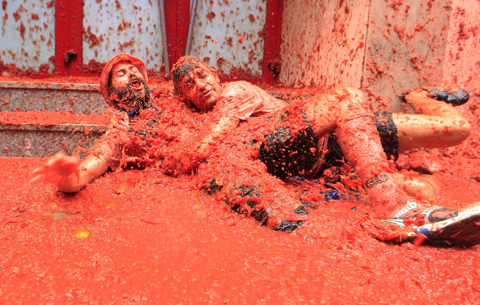 Revelers enjoy as they throw tomatoes at each other, during the annual &quot;Tomatina&quot;, tomato fight fiesta, in the village of Bunol, 50 kilometers outside Valencia, Spain, Wednesday, Aug. 30, 20 ...