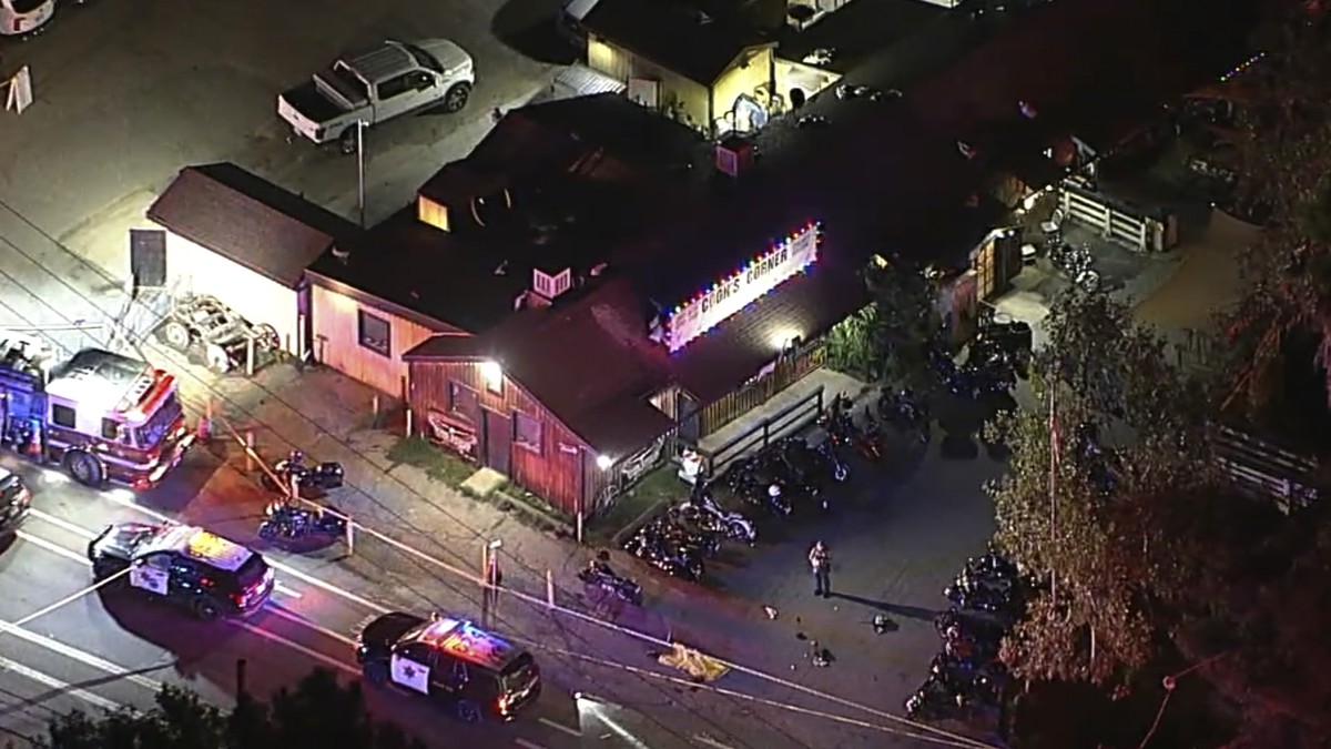 In an image from video, authorities work at the scene of a fatal shooting Wednesday, Aug. 23, 2023, at Cook's Corner, a biker bar in rural Trabuco Canyon, Calif., in Orange County. (ABC7 Los Ange ...