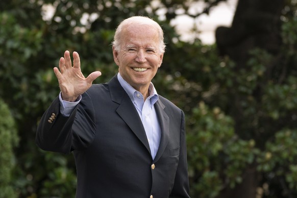 President Joe Biden waves as he walk to board Marine One on the South Lawn of the White House in Washington, on his way to his Rehoboth Beach, Del., home after his most recent COVID-19 isolation, Sund ...