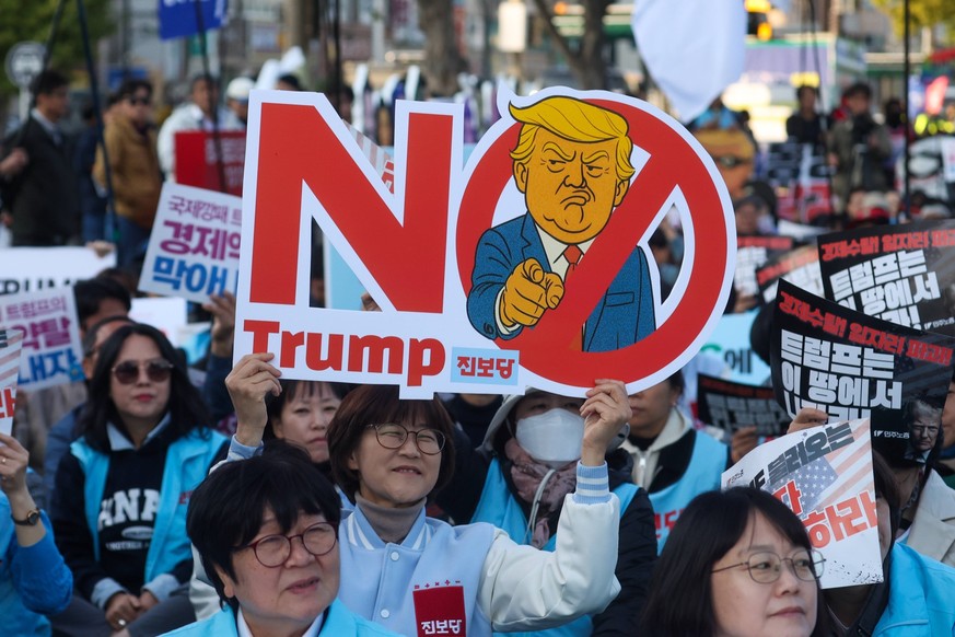 Anti-Trump rally in South Korea: People partake in a rally to protest against United States President Donald Trump, who is in the country attending the APEC Leaders Week summit, in Gyeongju, South Kor ...