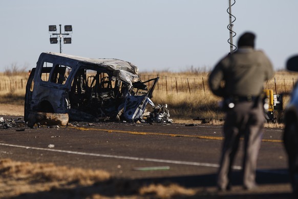 Texas Department of Public Safety Troopers look over the scene of a fatal car wreck early Wednesday, March 16, 2022 half of a mile north of State Highway 115 on Farm-to-Market Road 1788 in Andrews Cou ...