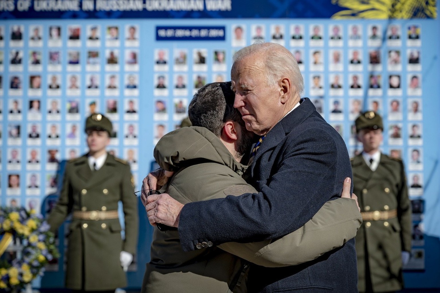 epa10479725 A handout photo made available by the Ukrainian Presidential Press Service on February 20, 2023 shows Ukrainian President Volodymyr Zelensky (L) and US President Joe Biden (R) embracing.