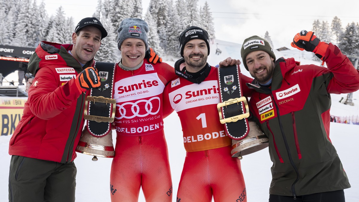 epa11820321 Thomas Tumler of Switzerland, Winner Marco Odermatt of Switzerland, Second placed Loic Meillard, and Luca Aerni of Switzerland, from left, take a pose and celebrate after the men's Gi ...