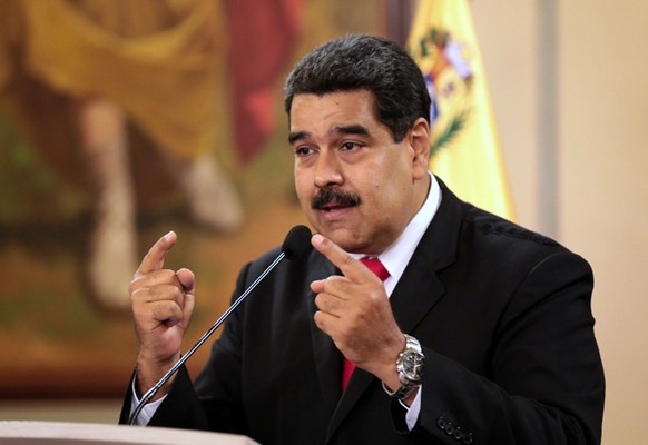 epa06928238 A handout photo made available by Miraflores press office shows the president of Venezuela Nicolas Maduro offering statements to the press, in Caracas, Venezuela, 04 August 2018. Maduro cl ...