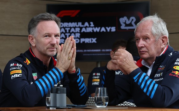 epa11751253 Red Bull motorsport advisor Helmut Marko(R) and his Team chief Christian Horner (L) sit before the Formula 1 Qatar Grand Prix at the Lusail International Circuit racetrack in Lusail, Qatar ...