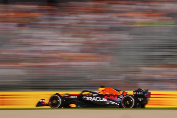 Red Bull driver Max Verstappen of Netherlands races past fans during the Australian Formula One Grand Prix at Albert Park in Melbourne, Sunday, April 2, 2023. (AP Photo/Scott Barbour)