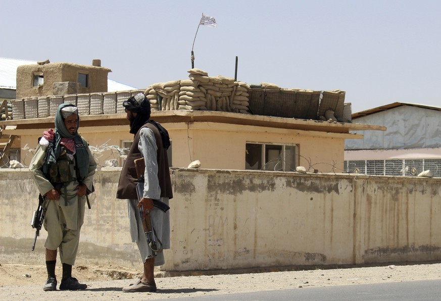 Taliban fighters stand guard inside the city of Ghazni, southwest of Kabul, Afghanistan, Friday, Aug. 13, 2021. The Taliban have completed their sweep of the country���s south on Friday, as they took  ...